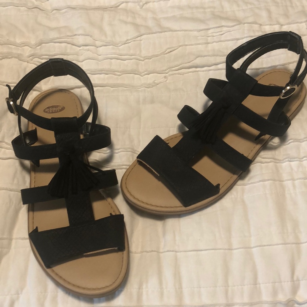 Black strappy sandals with tassels